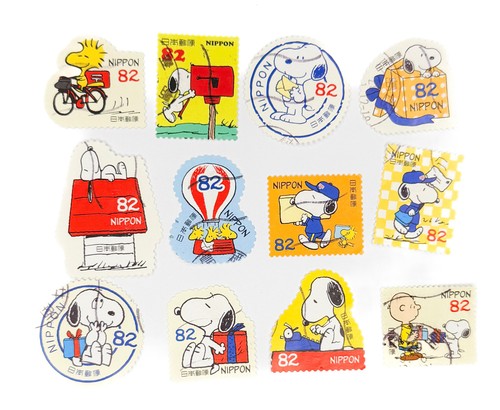 12-x-peanuts-snoopy-japanese-used-postage-stamps-off-paper