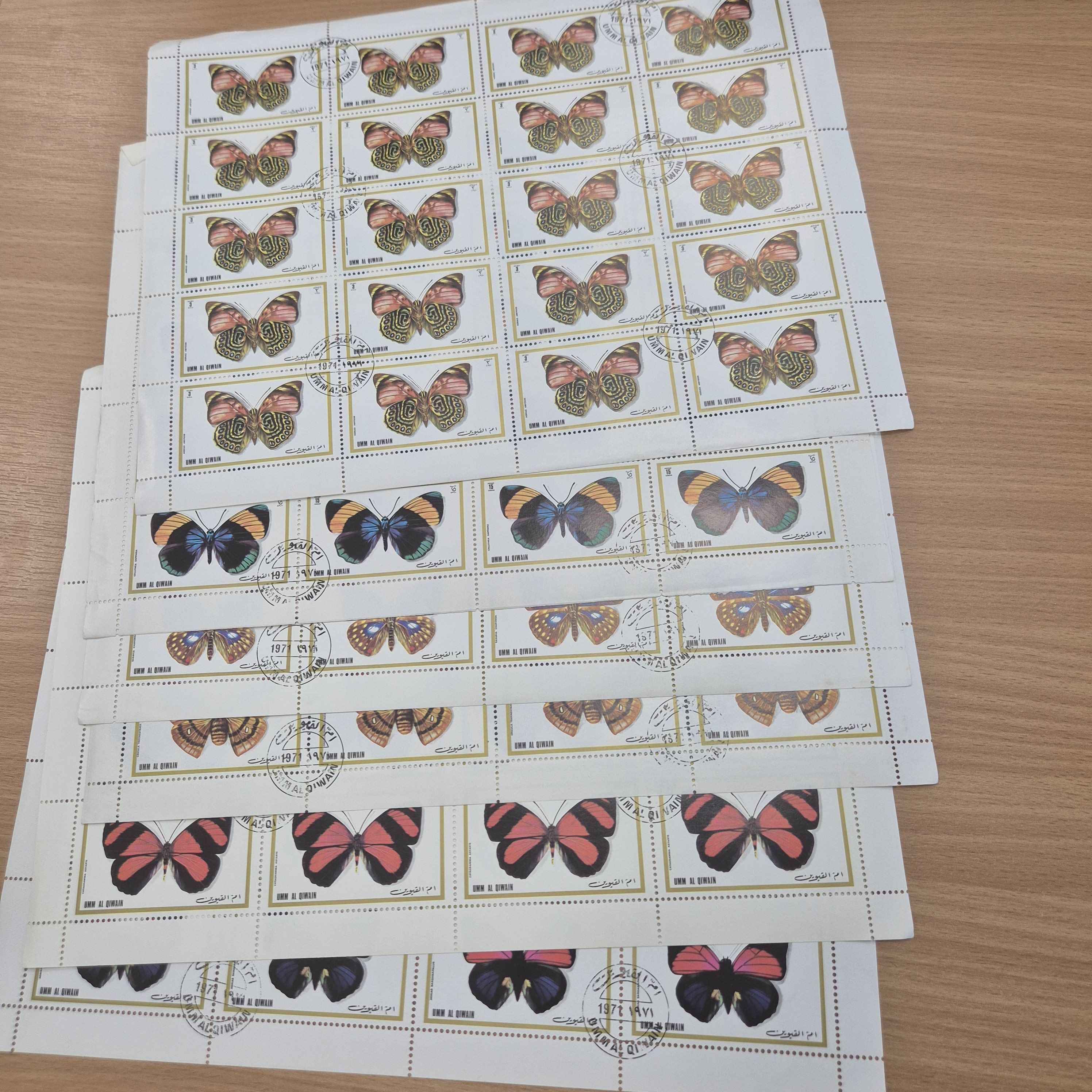umm-al-quwain-butterflies-sheets-of-stamps-used