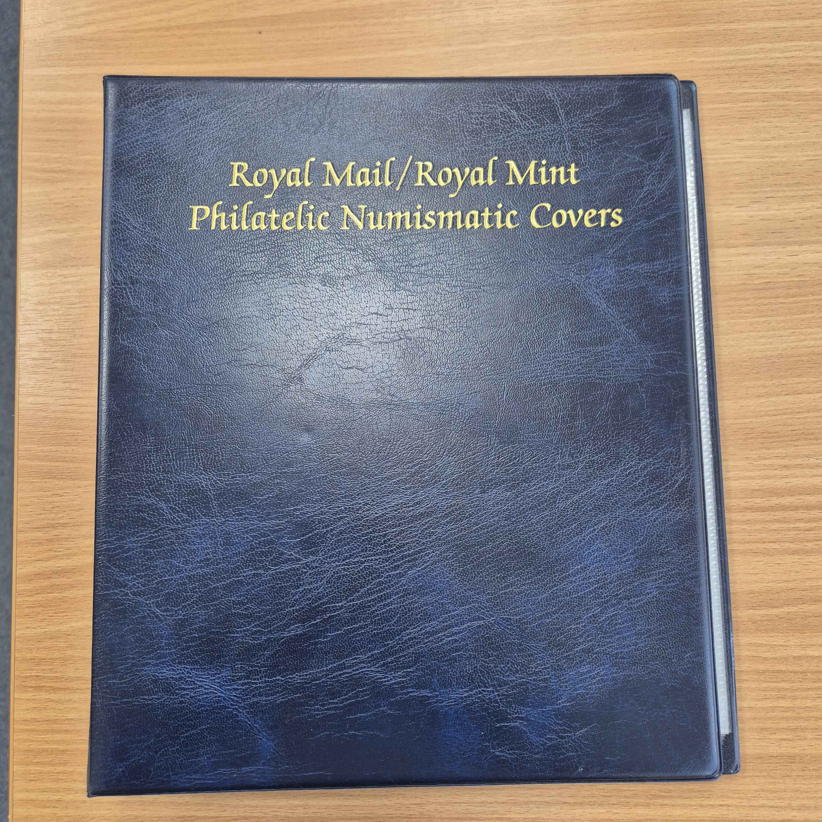 royal-mail-royal-mint-philatelic-numismatic-covers-blue-album-with-pages