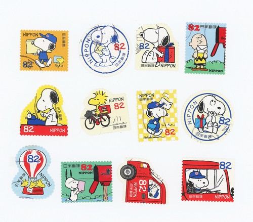 12-x-peanuts-snoopy-japanese-used-postage-stamps-off-paper